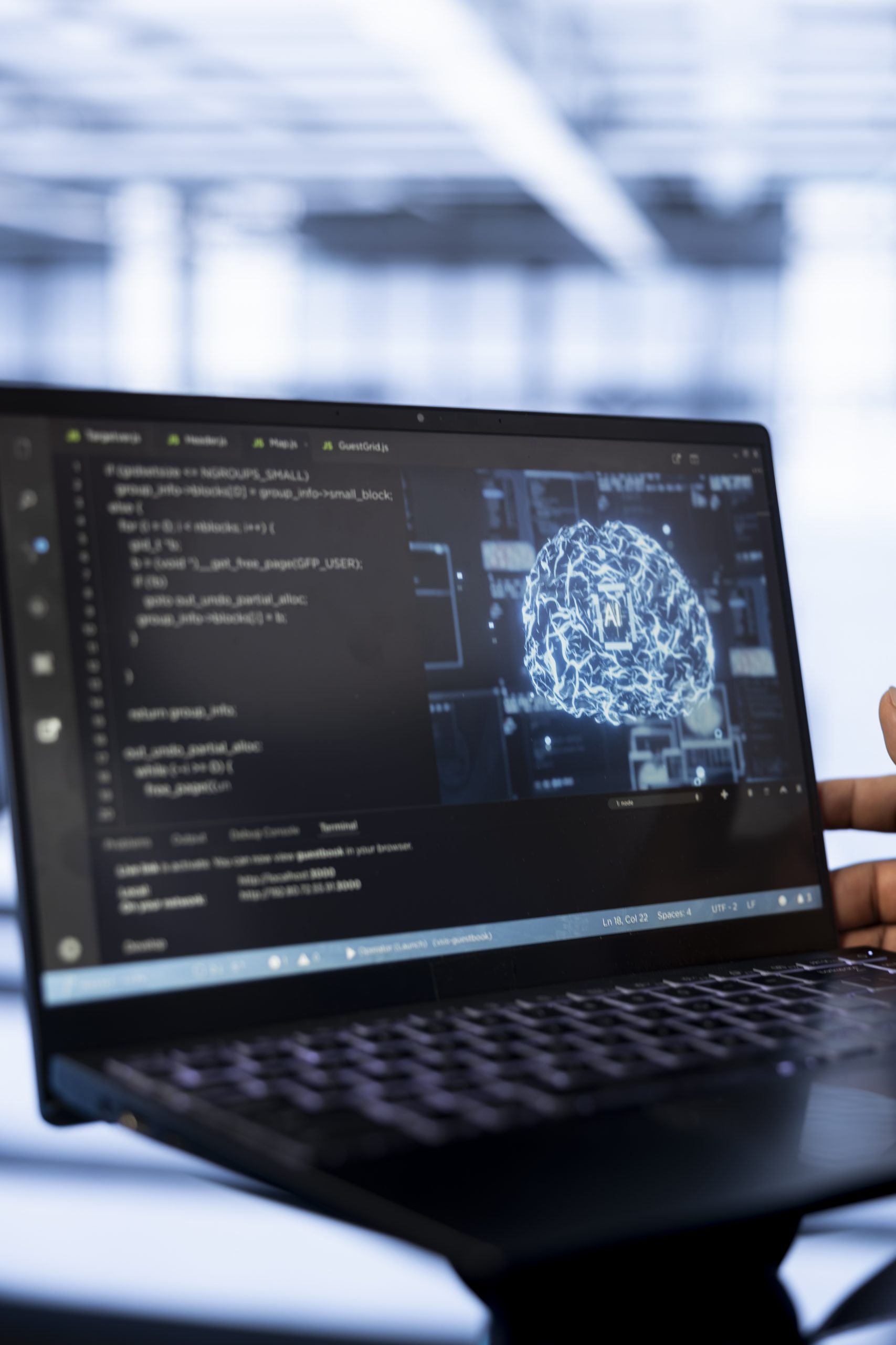 computer-scientist-using-laptop-data-center-updating-ai-scaled.jpg